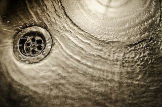 Water draining from a sink Water draining from a sink