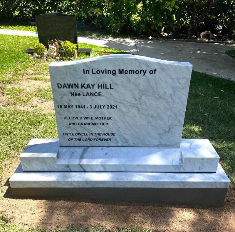 Semi Monument - Carrara marble memorial with inscribed letters painted black.