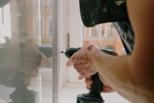 glazier repairing broken glass