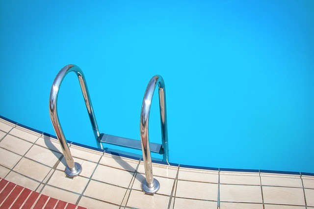Swimming pool with ladder