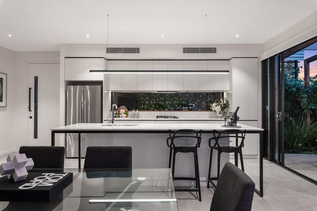 Glass dining table and kitchen