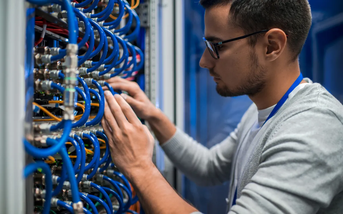 electrical contractor checking data cabling
