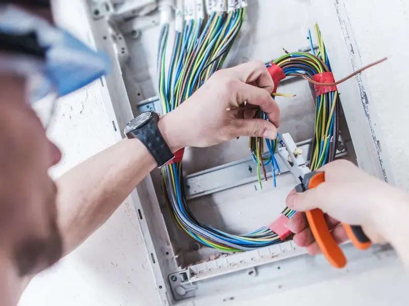 technician working on coloured data cables