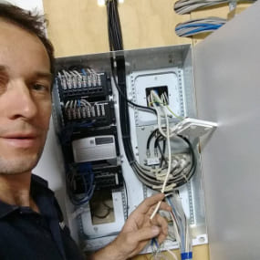 technician checking electrical wires