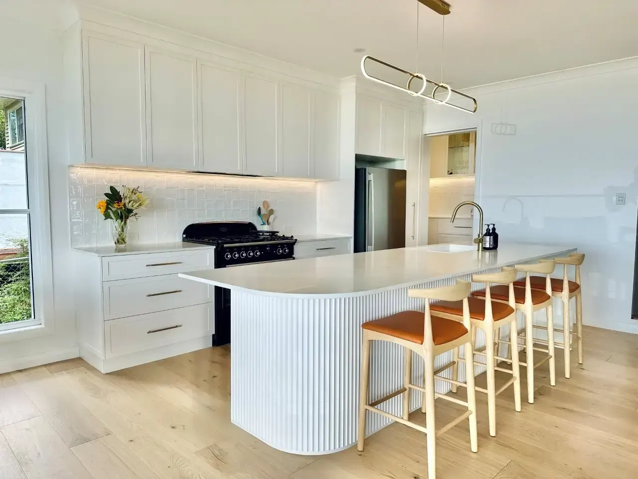Haddon Kitchens created a seamless and elegant space to enjoy as well as the perfect butler's pantry, this kitchen is every entertainer's and home cook's dream. features: sleek stone benchtops, to spacious sinks and a sophisticated island.