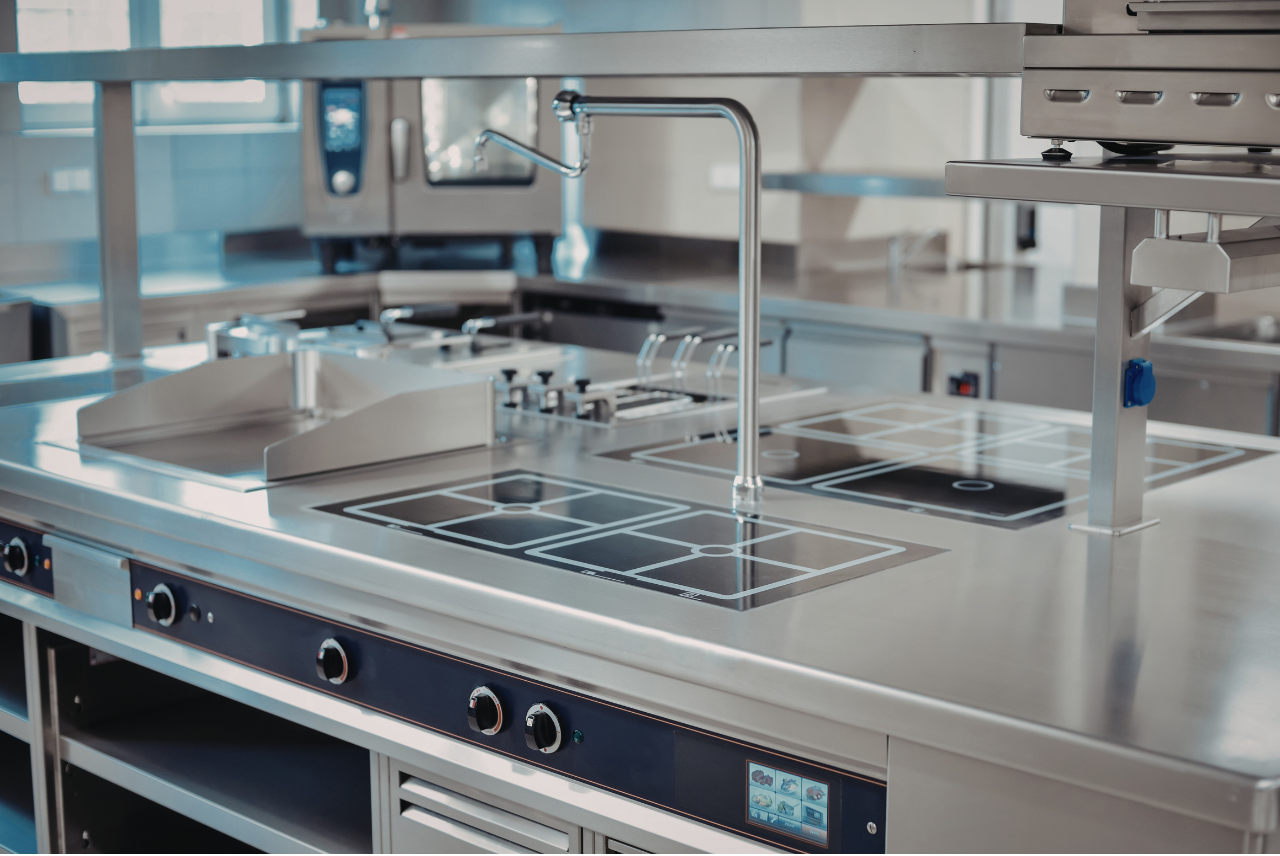 Beautifully clean stainless steel kitchen benchtop which is wiped down on a daily basis with a microfibre cloth in the direction of the grain using mild dish soap if necessary