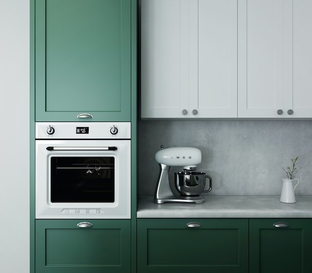 Green kitchen with smeg wall oven