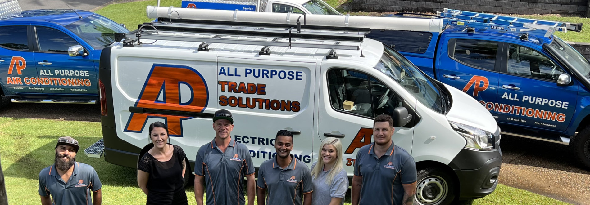 All Purpose Trade Solutions team standing with branded ute