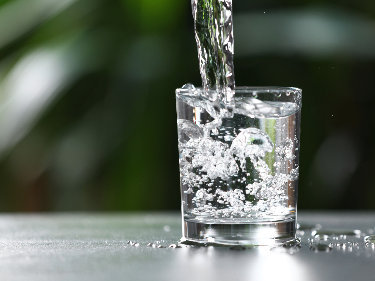 Clean water being poured into a glass