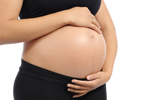 Pregnant woman with baby bump showing