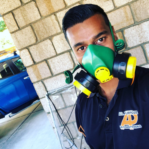 Avneel All Purpose Air Conditioning owner wearing breathing protection