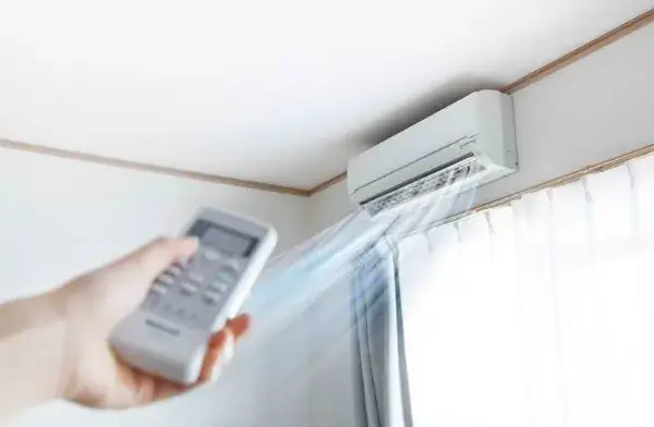 air con with remote being used