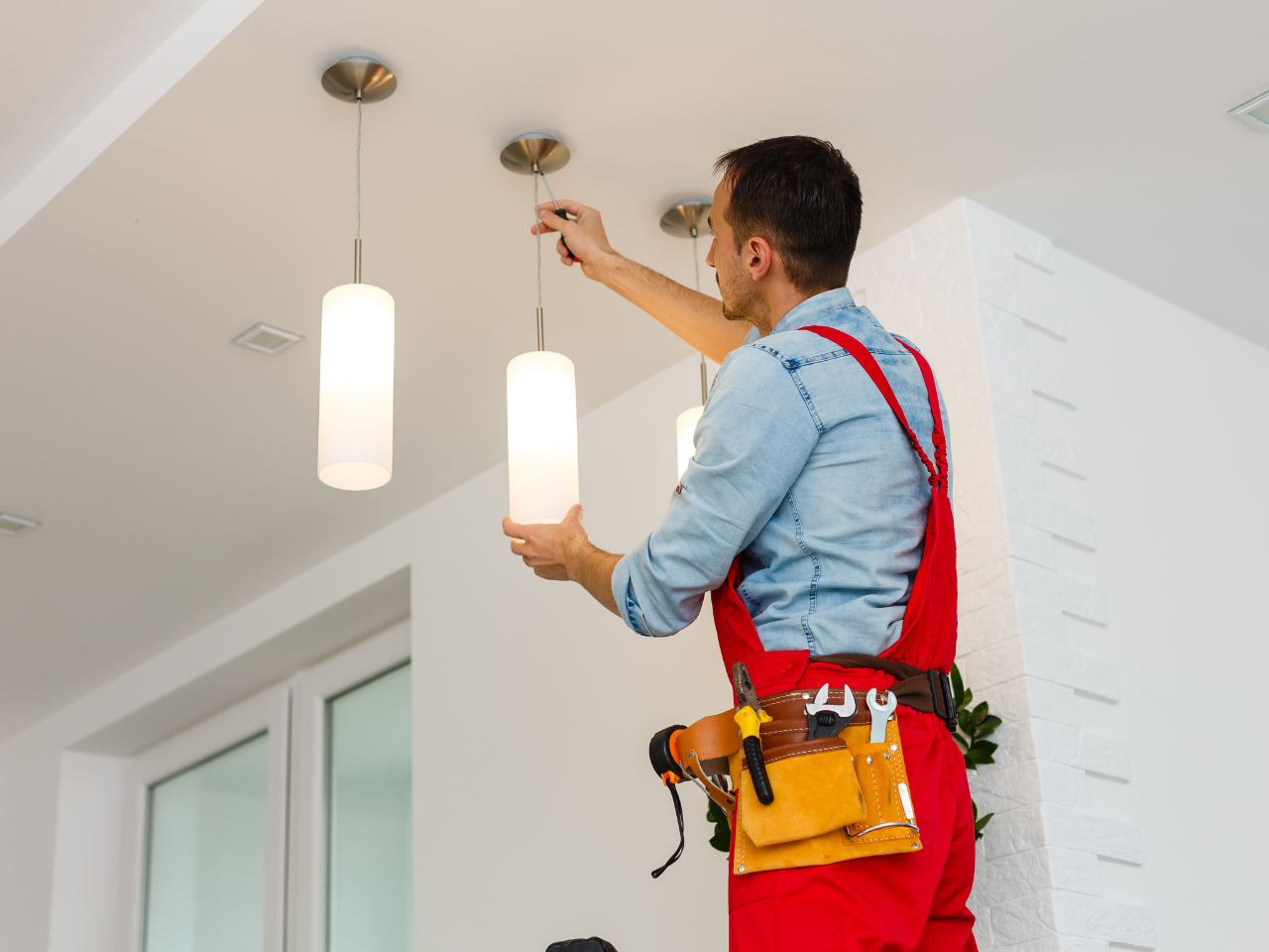 electrician installing lights