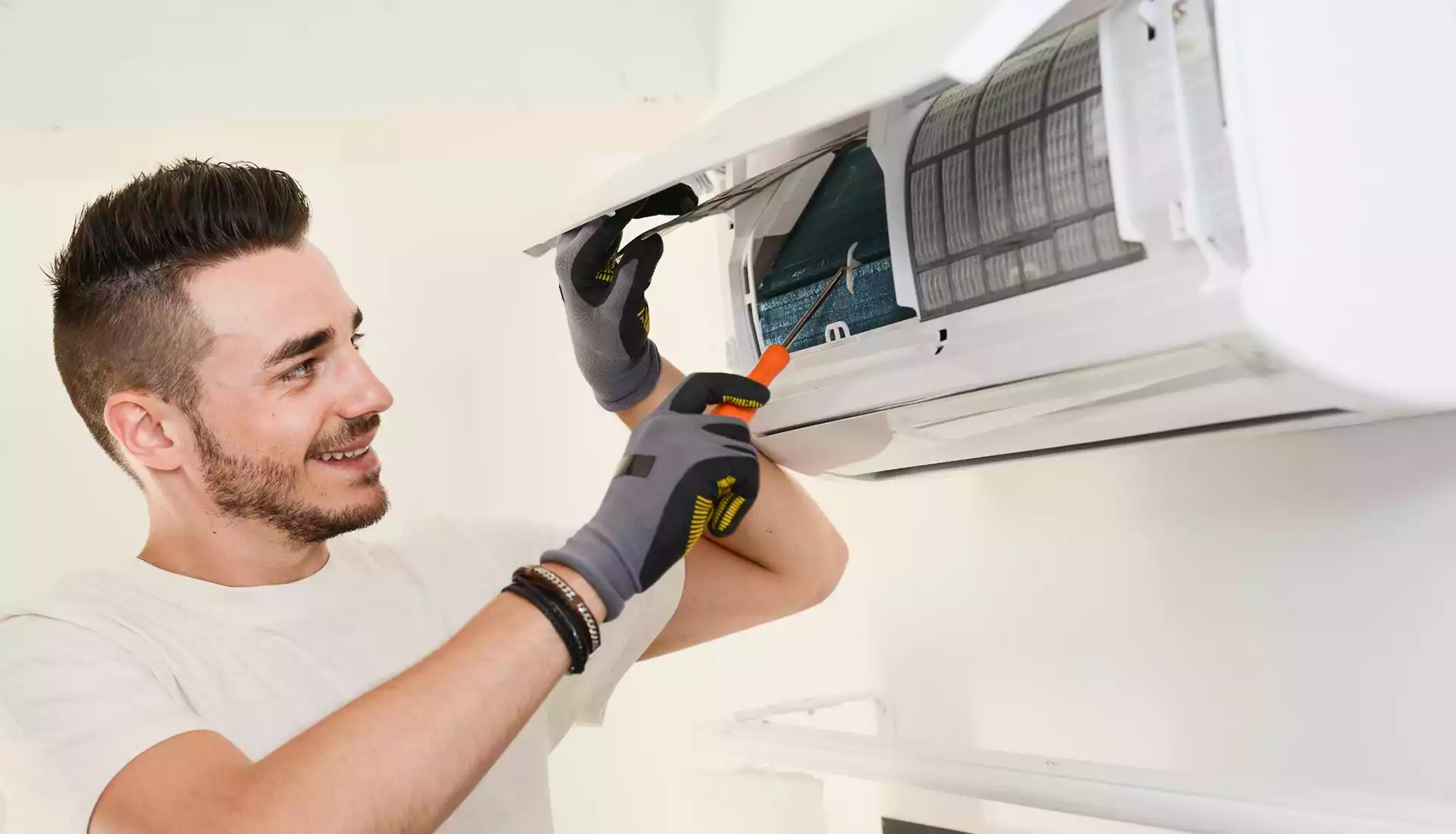 Technician installing AC