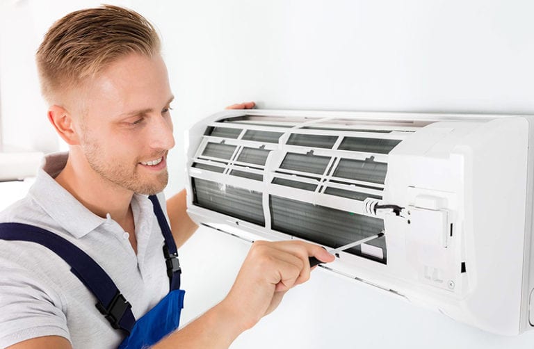 technician fixing air conditioning, indoor unit 