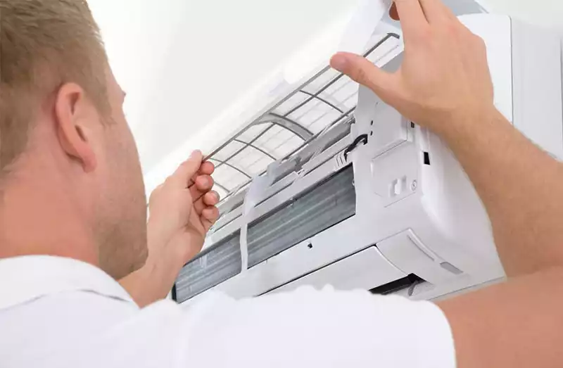 technician repairing indoor unit