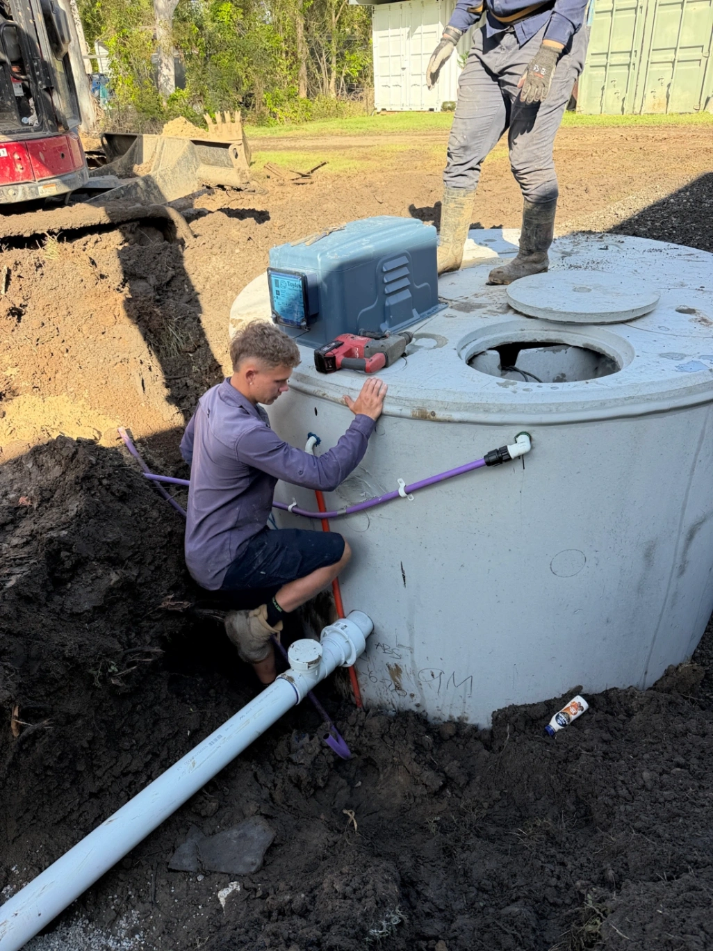 Braving Wet Weather To Install Septic Tank