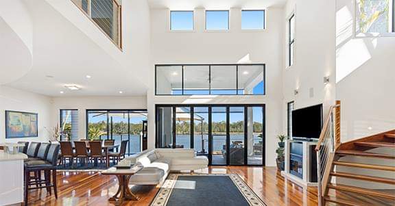 Stunning new home design & build from Symcorp. This stunning open living area features maximised natural lighting with outdoor views through bi-fold doors. Accentuates perfect indoor-outdoor living