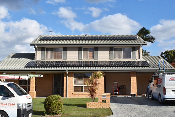 Solar installer with van in front of house