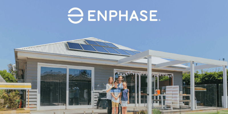 Enphase solar system atop a house with happy family