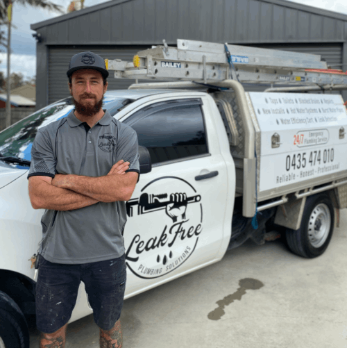 Leak Free Plumber next to work van