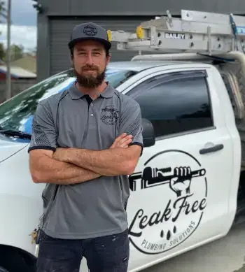 technician standing next to his van