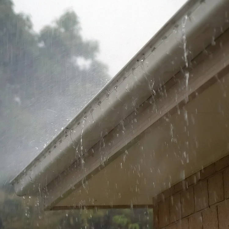 water pouring out of gutters