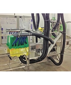 Crate drying system with crate on conveyor showing air nozzles, hoses