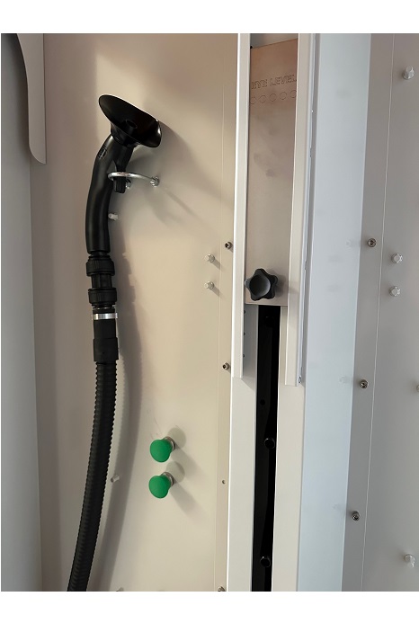 Image of hand held hose inside the JetBlack Safety Hybrid Personnel Cleaning Booth (BH05)