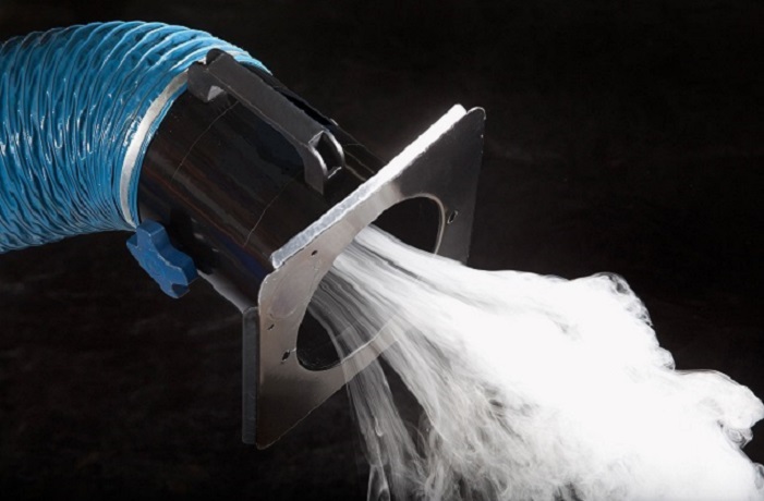 Smoke sucked into a fume extraction hood and blue hose