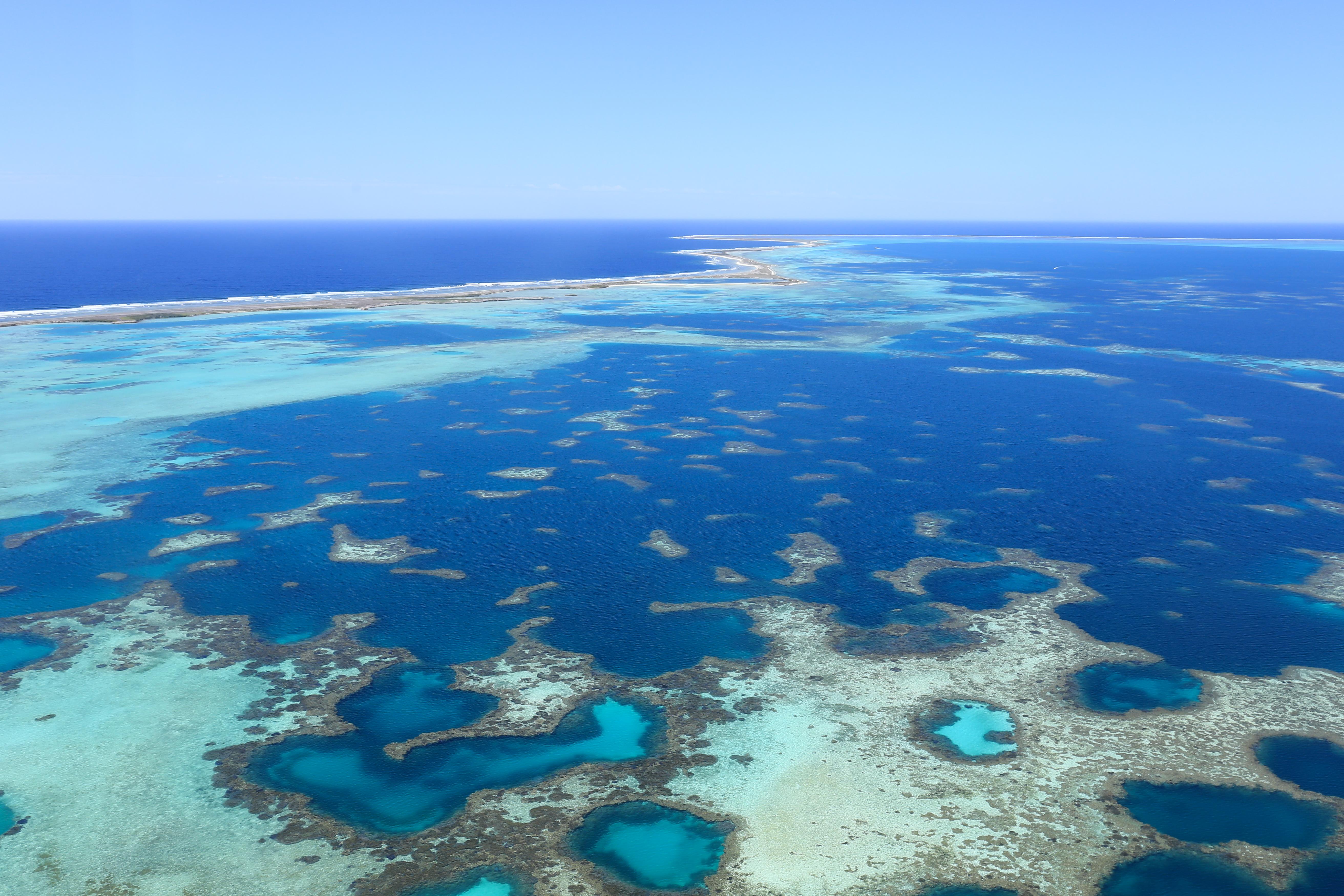 A captivating image from the Abrolhos Islands, featuring turquoise waters and coral formations. 