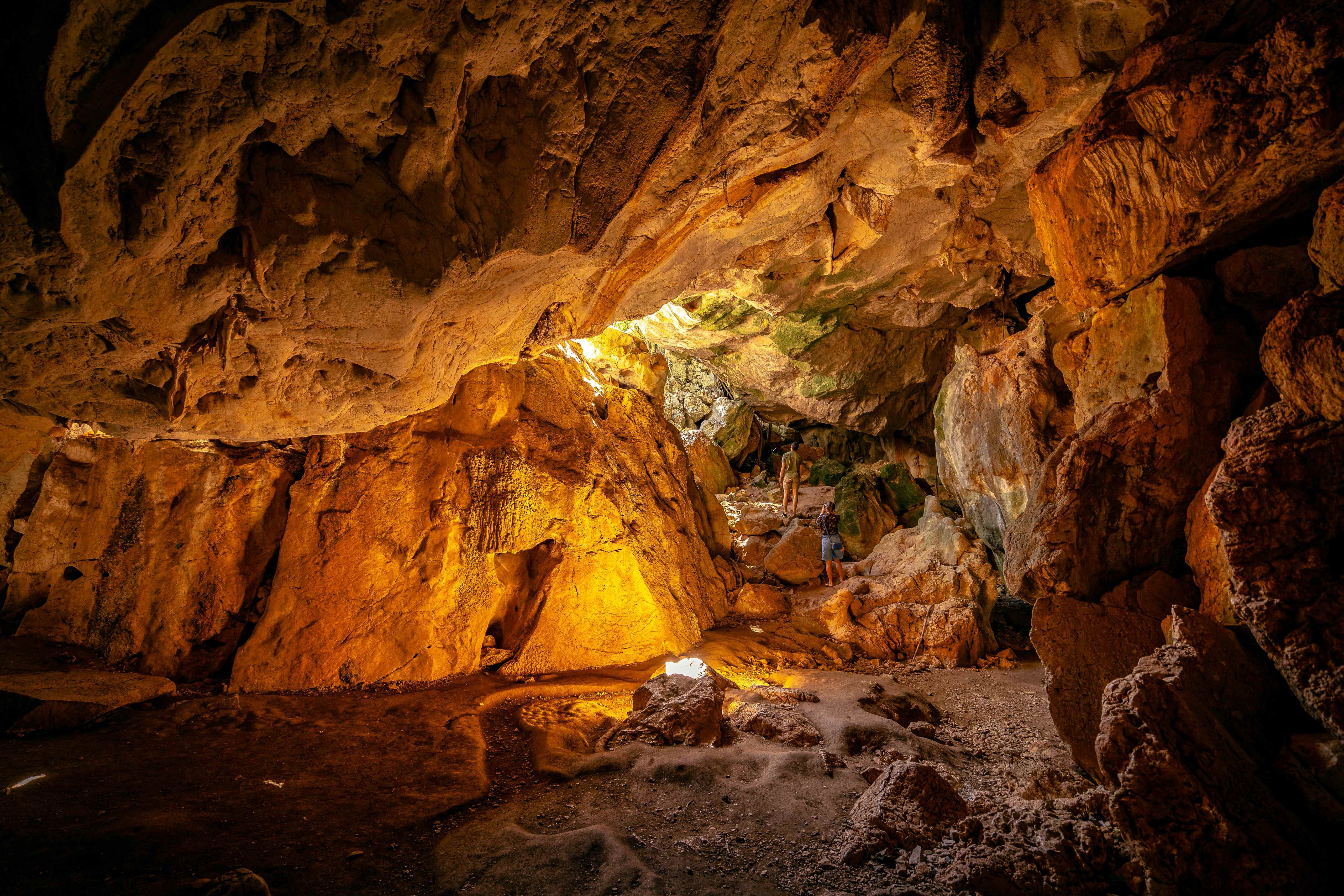A captivating image of the interior of Capricorn Caves, showcasing intricate limestone formations and the unique underground environment.