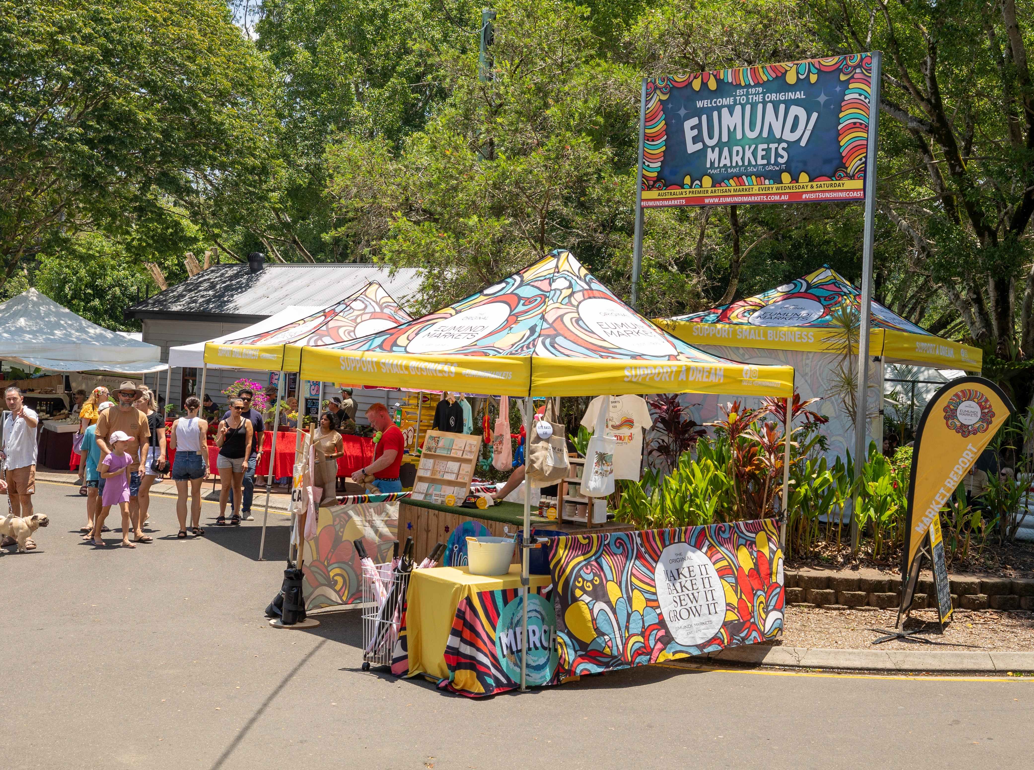  A vibrant image from Eumundi Markets, showcasing colorful stalls, local produce, and a lively atmosphere. 