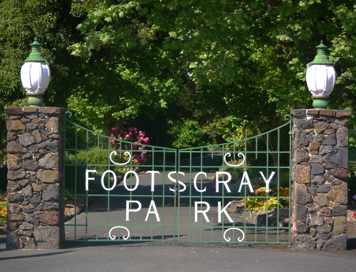 Scenic view of Footscray Park along the Maribyrnong River, featuring its Edwardian-style landscaped gardens with vibrant flower beds, expansive lawns, and a picturesque ornamental pond. This image captures the tranquil beauty and historical significance of the park, established in 1911 and cherished as one of Melbourne’s largest heritage-listed parks. It’s a popular spot for community gatherings, leisure activities, and the annual Footscray Park Fireworks event.