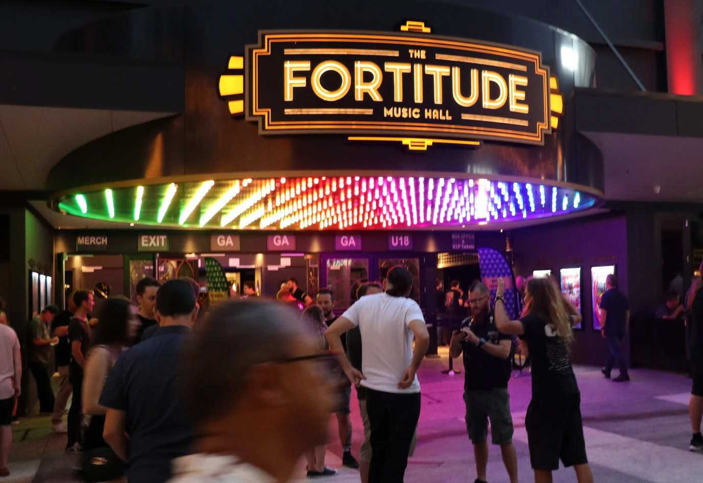 A snapshot of Fortitude Valley's vibrant streets, showcasing colorful street art, bustling cafes, and the energetic ambiance of the area. 