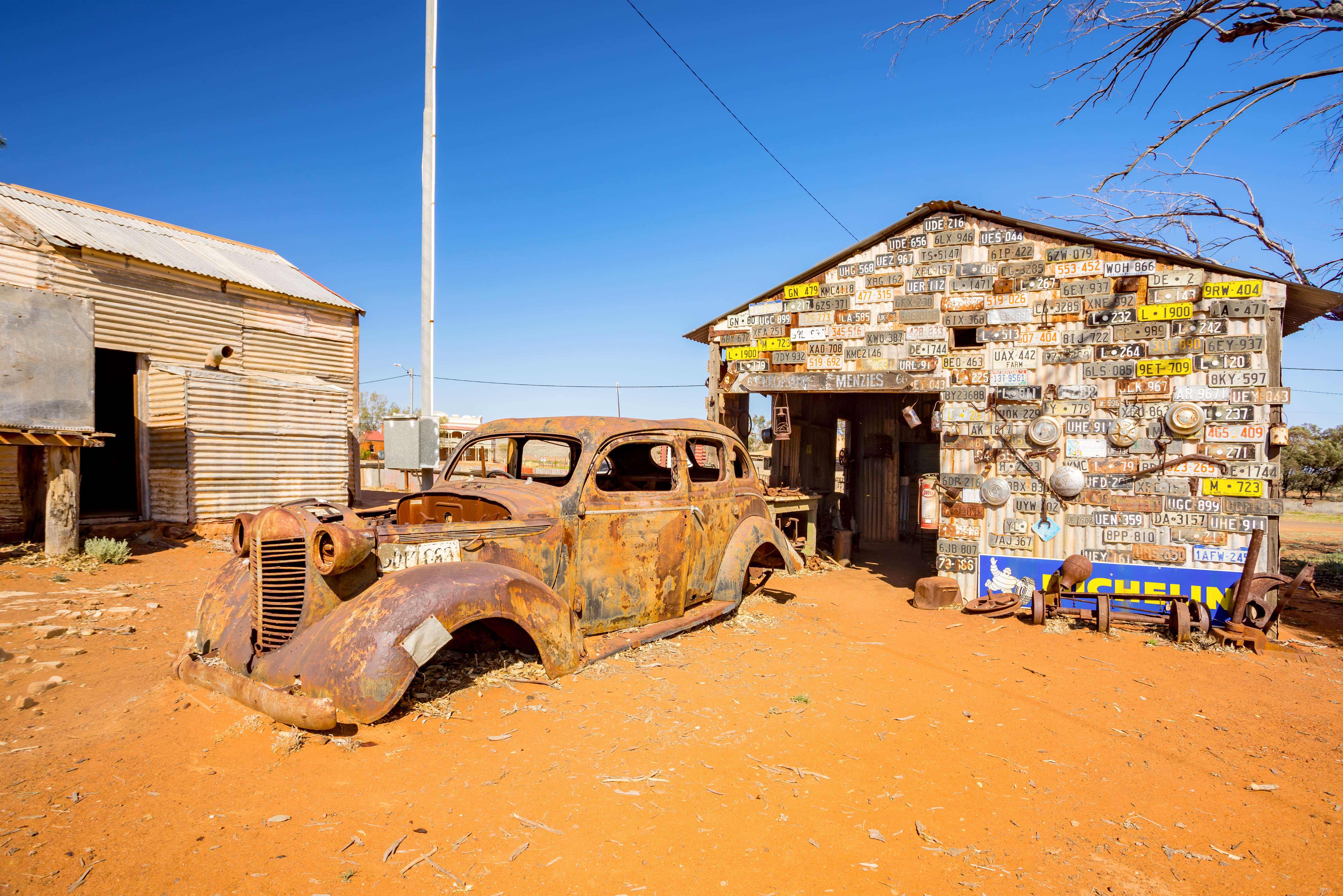 An evocative scene from Gwalia Ghost Town, featuring abandoned buildings and remnants of the gold mining era.