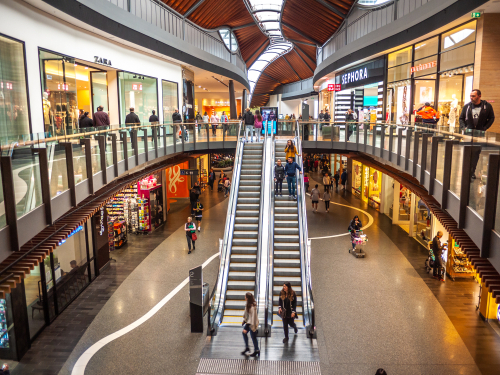 Interior view of Highpoint Shopping Centre in Western Melbourne, showcasing its vast, bustling spaces filled with a variety of retail stores. The image captures shoppers enjoying the modern amenities and diverse shopping options, from high-end fashion boutiques to popular dining spots. This scene highlights Highpoint's role as a major retail and cultural hub in Western Melbourne, reflecting the local community’s tastes and preferences