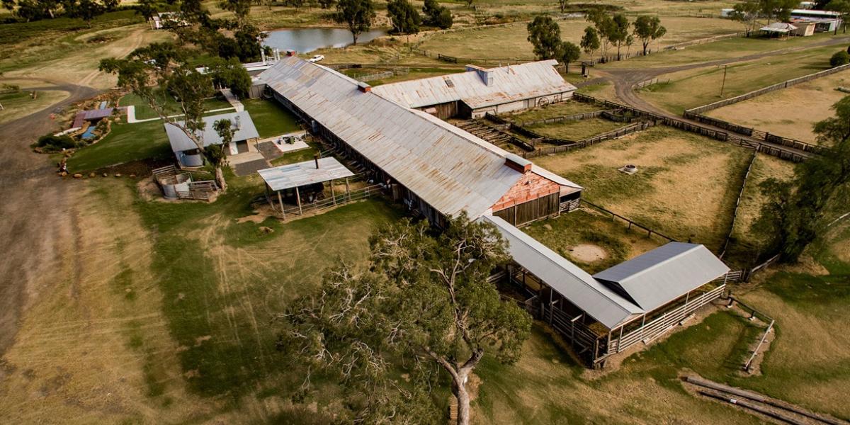 A photo capturing the rustic charm of the Jondaryan Woolshed, with historic buildings and wool-processing equipment on display. 