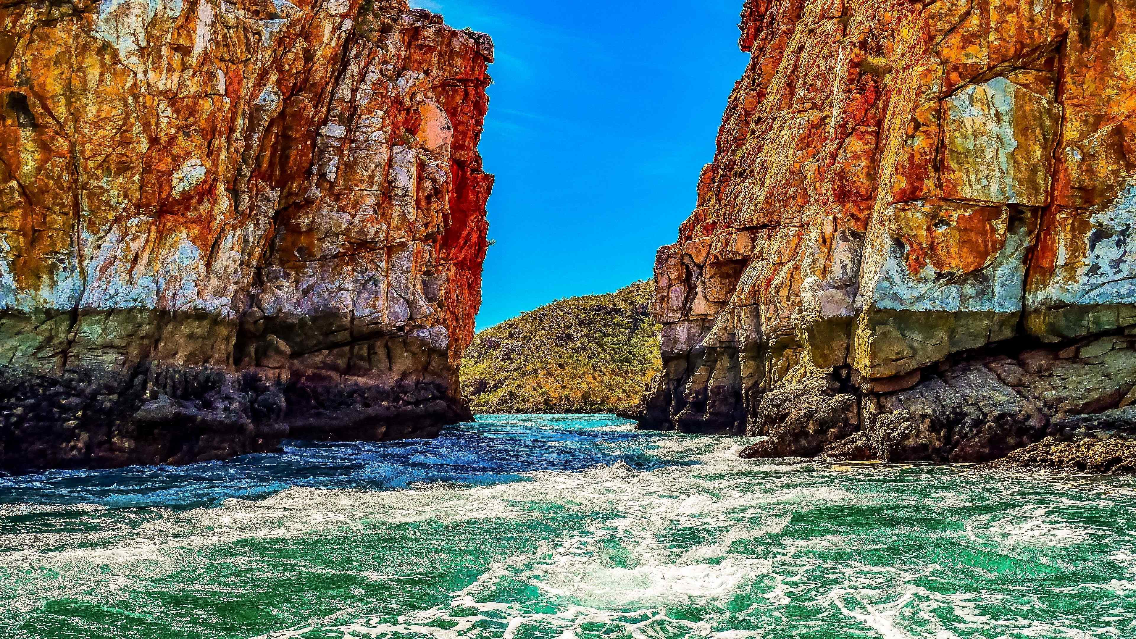An awe-inspiring view of Horizontal Falls, showcasing the rushing waters between narrow coastal gorges. 