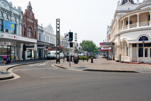 The heart of Maitland's town center, bustling with activity, where historic buildings line the streets alongside contemporary cafes and shops, encapsulating the city's charming duality.