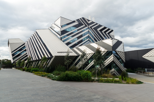 The iconic Clayton campus of Monash University in Southern Melbourne, viewed from above, showing its sprawling layout and modern facilities. Known for its academic excellence and innovative research, Monash University's buildings are interspersed with green spaces, reflecting a commitment to sustainability and a conducive learning environment. This image emphasizes the university's role as a hub of education and research, contributing significantly to the intellectual and cultural fabric of Southern Melbourne.