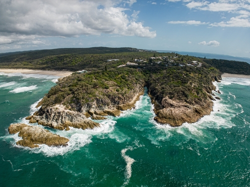 Discover North Stradbroke Island, a jewel in Queensland's crown, featuring endless beaches, crystal-clear waters, and lush greenery. This world-renowned sand island offers a perfect escape with its stunning landscapes, wildlife encounters, and tranquil beach settings. Ideal for adventure, relaxation, and nature exploration.