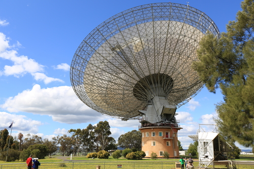 The impressive Parkes Radio Telescope, standing tall against the backdrop of the Australian landscape, a symbol of significant scientific achievements and space exploration history    