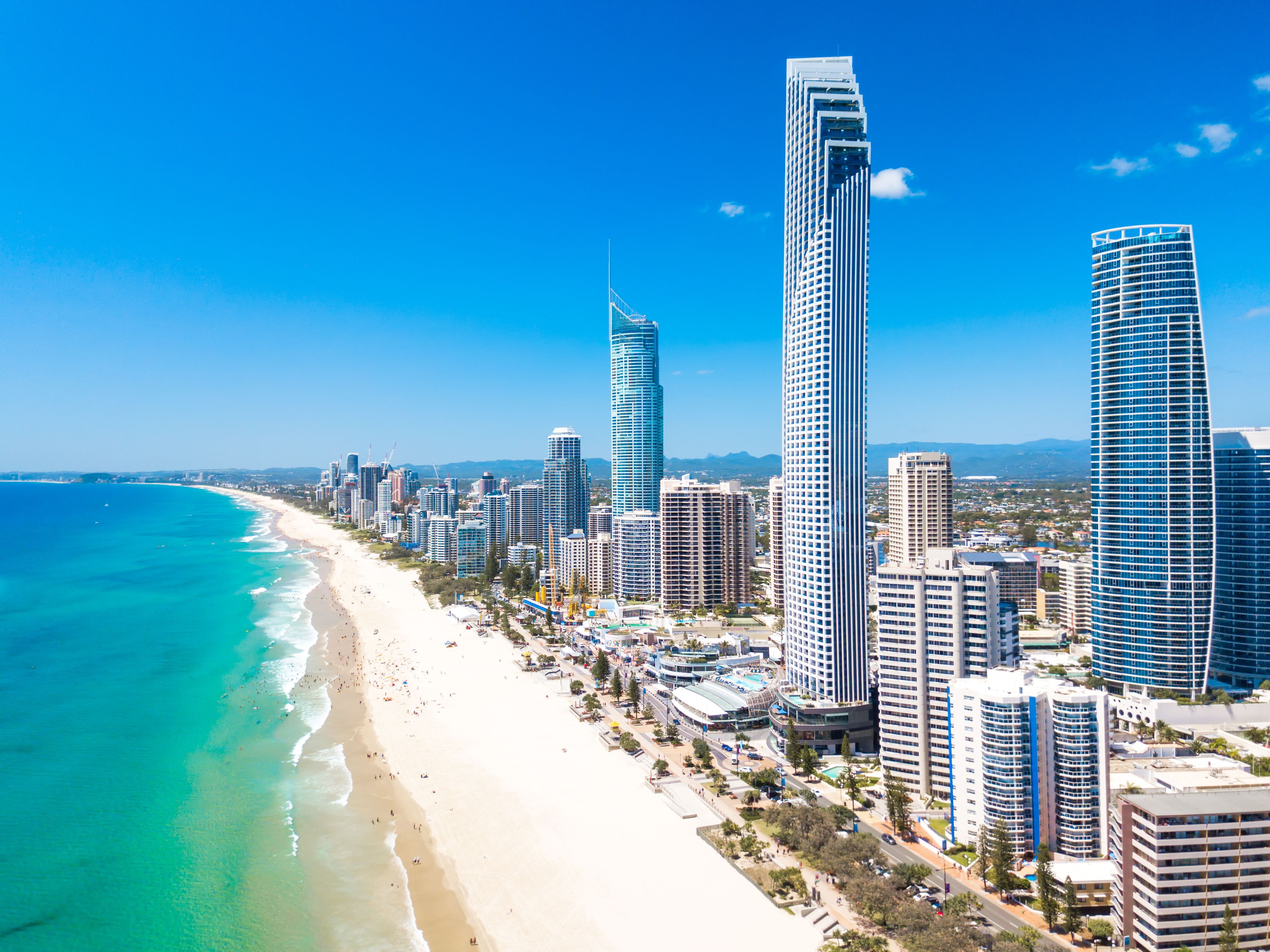 A breathtaking view from the top of the Q1 Building, showcasing the Gold Coast skyline, beaches, and lush hinterland. 