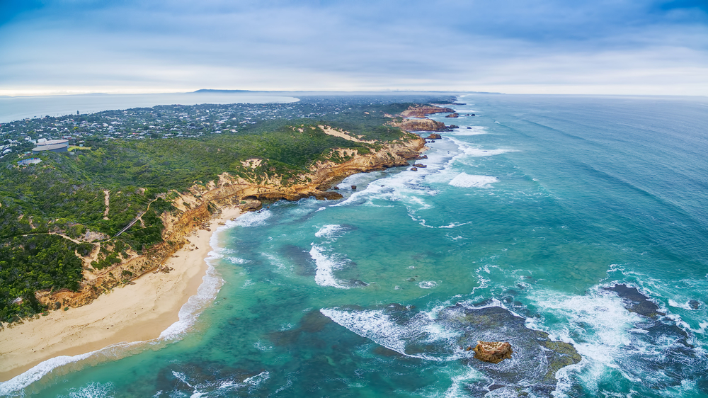 Sorrento Beach is portrayed as a quintessential Australian beach destination, offering both relaxation and a variety of water sports, making it a favorite spot for a dynamic beach experience.
