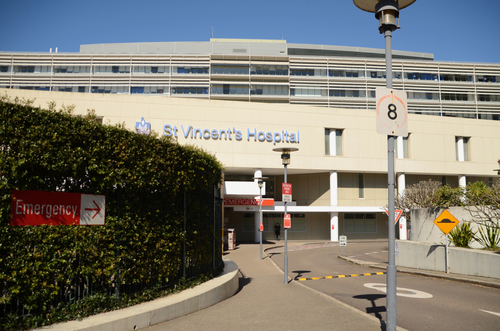 A modern and bustling scene of St. Vincent's Hospital, illustrating its state-of-the-art facilities and compassionate healthcare professionals, dedicated to serving the diverse healthcare needs of the Inner East community.