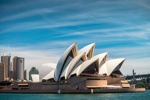The majestic Sydney Opera House, with its unique sail-like design, stands as a stunning focal point on the harbour, embodying the city's creative spirit and architectural innovation, set against the backdrop of the sparkling Sydney Harbour.
