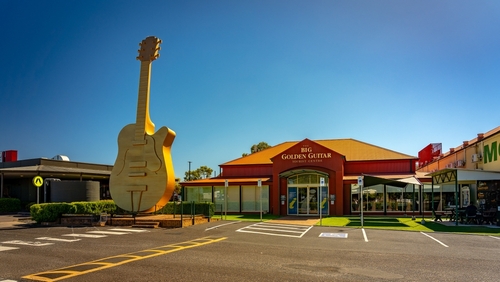 The vibrant atmosphere of Tamworth, captured during the bustling Country Music Festival, with streets alive with music, performances, and cultural festivities, embodying its title as the Country Music Capital of Australia. 