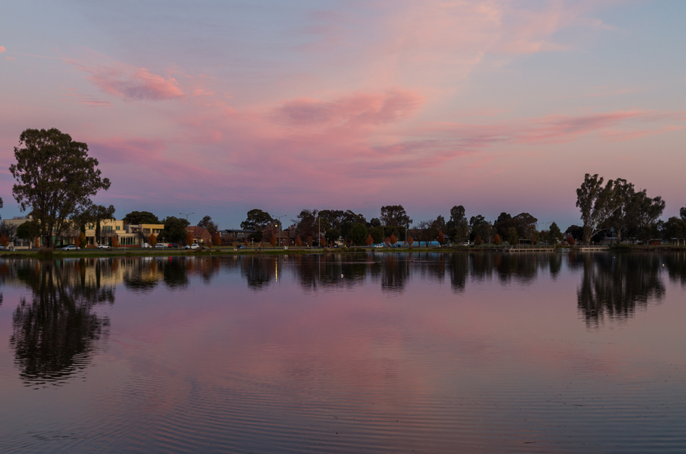 An image capturing the serene environment of Victoria Park Lake in Shepparton. This picturesque scene highlights the lake as a central hub for community recreation and outdoor activities, embodying the vibrant community spirit of Shepparton.