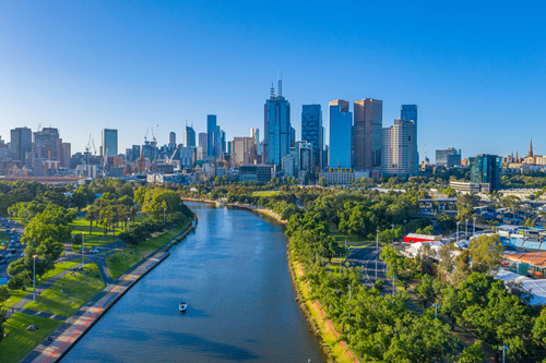 A serene view of the Yarra River as it winds through the Darebin area, featuring lush greenery and a clear walking path. The image captures the tranquil beauty of the river, emphasizing its importance as a natural retreat within the North Eastern Suburbs of Melbourne.